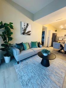 a living room with a couch and a table at Apartment Luxury ONA Residence, Punta Cana in Punta Cana +20 photos