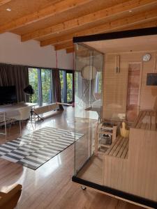 a living room with a glass case in a room at Detmolder Loft 3 in Detmold
