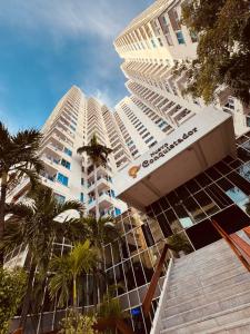 a large building with palm trees in front of it at apartamento 1302 in Cartagena de Indias