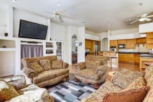 a living room with two couches and a tv at Groups Welcome! Home w/ Pool + Patio in N Phoenix in Phoenix