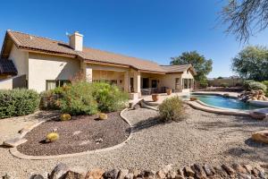 a house with a swimming pool in the yard at Groups Welcome! Home w/ Pool + Patio in N Phoenix in Phoenix