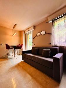 a living room with a couch and a table at Monte Carlo Vista in Beausoleil +15 photos