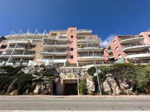a large apartment building on a hill with a building at Monte Carlo Vista in Beausoleil
