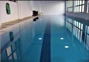 an empty swimming pool with a blue tile floor at Studio apartment in Gatunga