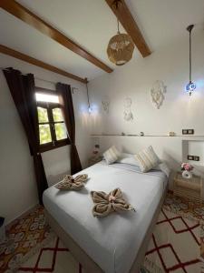 Postel nebo postele na pokoji v ubytování Dar Diamante Azul