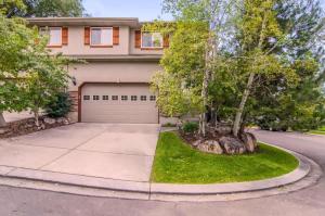 a house with a tree in front of a driveway at Union Grove in Salt Lake with Hot Tub and Foosball in Midvale