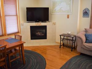 A television and/or entertainment centre at Ada O'Day Condos