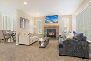 a living room with a couch and a fireplace at Union Park in Salt Lake with Hot Tub Near Park in Midvale
