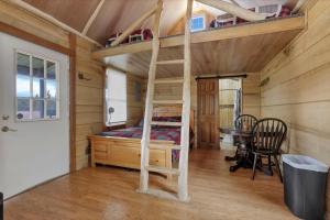 a bedroom with a bunk bed and a desk at Cozy Cabin in New Lexington