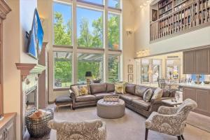 a large living room with a leather couch and chairs at Chateau Woodlands in Salt Lake with Guesthouse and Hot Tub in Holladay