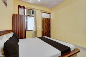 Postel nebo postele na pokoji v ubytování Hotel O Namastay