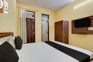 Postel nebo postele na pokoji v ubytování Hotel O Namastay