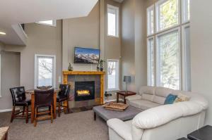 a living room with a couch and a fireplace at Union Cove in Salt Lake with Secluded Privacy in Midvale