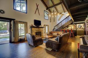 a living room with a couch and a fireplace at The ranch house #2501 in Sugarloaf