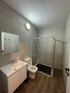 a bathroom with a shower and a sink and a toilet at Modern Studio in Central Victoria in Victoria +12 photos