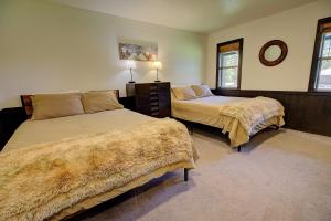 a bedroom with two beds and a mirror at The ranch house #2501 in Sugarloaf
