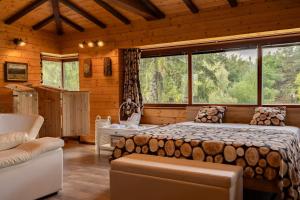 a bedroom with a bed and a large window at Abies Alba By Pinus Villas in Yarema residence zone +11 photos