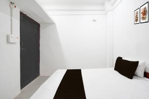 Postel nebo postele na pokoji v ubytování Hotel O Vijay Palace + 18 fotografií