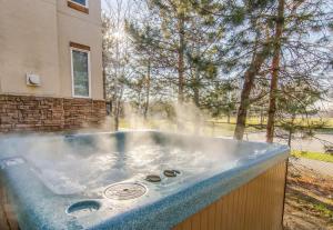 a hot tub with steam coming out of it at Union Cove 3-Plex in Salt Lake with Hot Tub in Midvale +53 photos