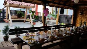 a table set up for a party on a patio at Guest House Chinar 08 in Kirkovo