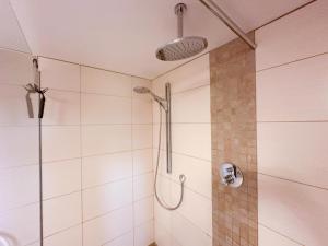 a bathroom with a shower with a glass door at Eifelleben Kleinlangenfeld in Kleinlangenfeld +25 photos