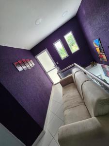an overhead view of a living room with purple walls at Alisos Suite FC in El Ceibal