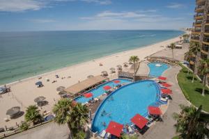 an aerial view of a resort with a beach and a swimming pool at Scenic & Spacious Adorable Ocean Front Condo in Puerto Peñasco