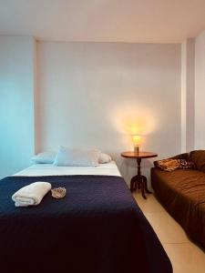 Una cama o camas en una habitación de Irlanda Hospedaje