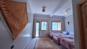 Postel nebo postele na pokoji v ubytování Assistance Imlil hostels + 20 fotografií