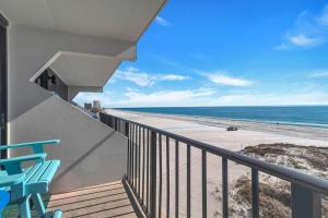 a balcony with a view of the beach at Island Winds East Condo 402 in Gulf Shores