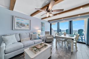 a living room with a couch and a table at Island Winds East Condo 402 in Gulf Shores +37 photos