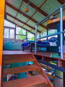 a room with benches and beds in a boat at El Huerto del Edén in Armenia +7 photos