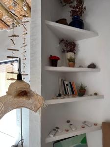 a living room with white shelves and a television at Los Perales in Sorbas