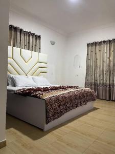 Postel nebo postele na pokoji v ubytování Ungess Luxury Serviced Apartment