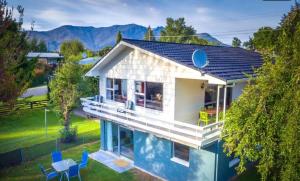 a house with a swimming pool in the backyard at Arrowtown Ambience in Arrowtown
