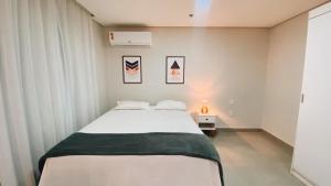 Postel nebo postele na pokoji v ubytování Flat novinho, perto de TUDO - Conforto total + 38 fotografií