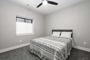 a bedroom with a bed and a ceiling fan at Saddle Ridge in Granby