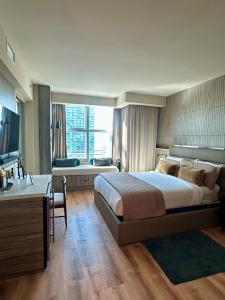 a bedroom with a large bed and a bathroom at AKA Brickell Condo Free Parking by Palermo Home Miami in Miami +117 photos