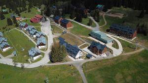 an aerial view of a town with buildings and a road at Apartmán P7 Horní Mísečky in Horni Misecky +4 photos