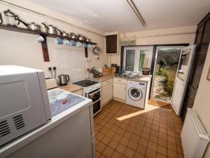a kitchen with a washer and dryer at 2 Bed in Studland DC069 in Studland