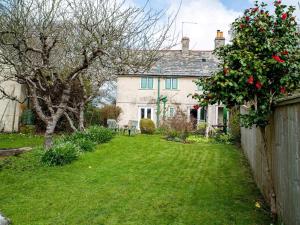 a house with a yard in front of it at 2 Bed in Studland DC069 in Studland +11 photos