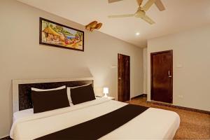 Postel nebo postele na pokoji v ubytování Super Townhouse Vaishnavi