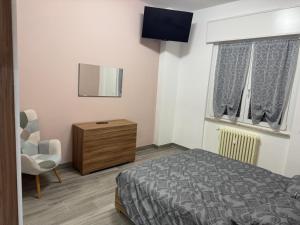 Ένα ή περισσότερα κρεβάτια σε δωμάτιο στο La Maison di Vivy, Malpensa-Rho Fiera Milano 15 min