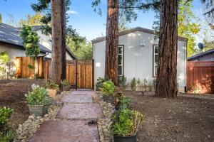 a home with trees and a walkway at Privately Secluded Guesthouse in Fremont