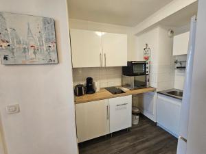 Kuchyň nebo kuchyňský kout v ubytování Cozy Corner