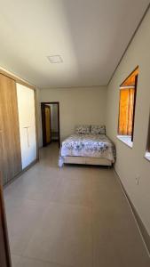 En eller flere senge i et værelse på Casa Rosada em Rio de Contas