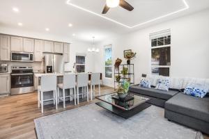 a living room with a couch and a table at Privately Secluded Guesthouse in Fremont