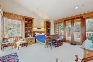a bedroom with a bed and a desk at Aspen Meadows Resort 111 in Aspen