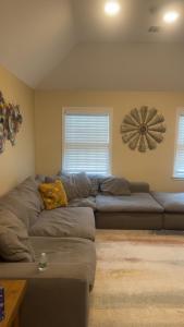 a living room with a couch and a fan at Enjoy with luxury house in North Haledon