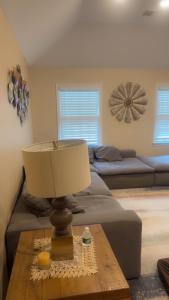 a lamp on a coffee table in a living room at Enjoy with luxury house in North Haledon